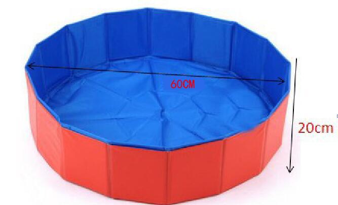 Foldable dog pool set up outdoors with a golden retriever inside